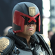 A fan cosplaying as Karl Urban’s version of Judge Dredd